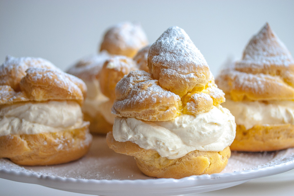 Cream puffs dusted with powdered sugar