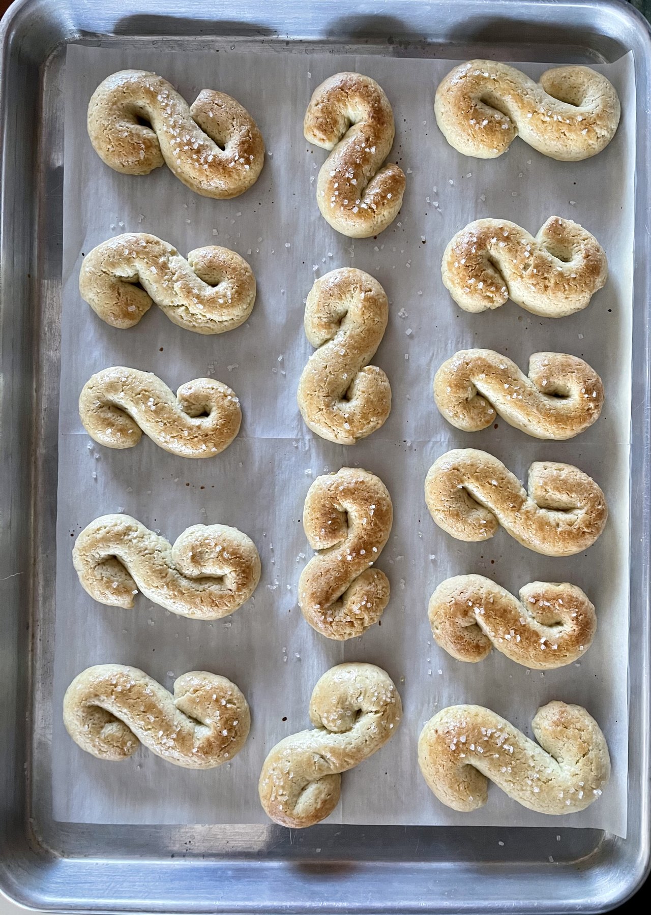 S-shaped sugar cookies on a baking sheet